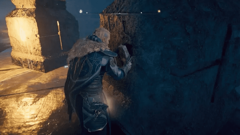 Eivor inserting the tablet in the pillar