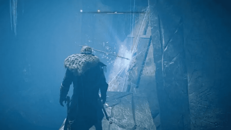 On the platform next to the spear