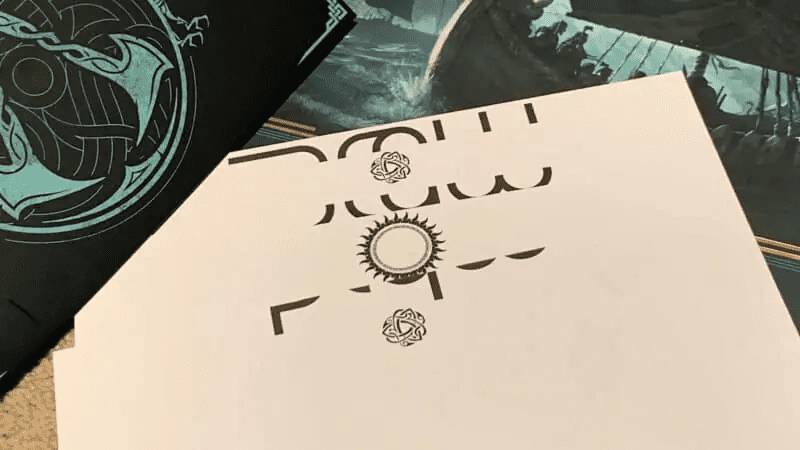 Lithograph arranged to keep the sun in the middle and the valhalla logos above and below it (Picture credits: Access the Animus on Youtube)