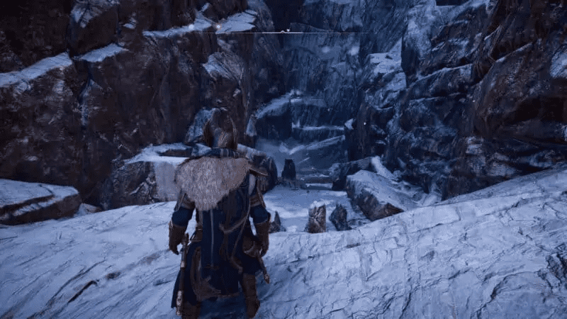 Large crater with the hammer stuck into the ground at the end of it