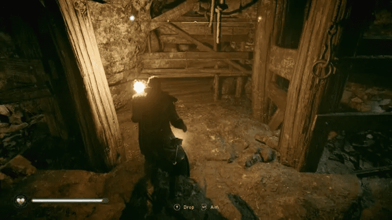 Small hole at the base of the wooden wall