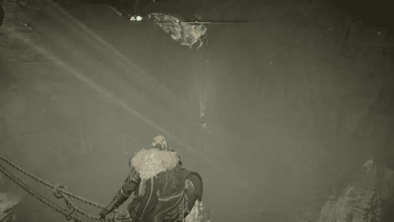 Facing the hanging key from the rope