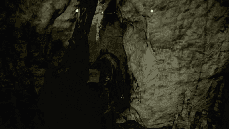Going through the narrow gap behind the moveable rock