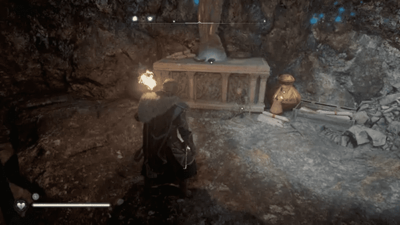 Loot and a key at the base of the statue