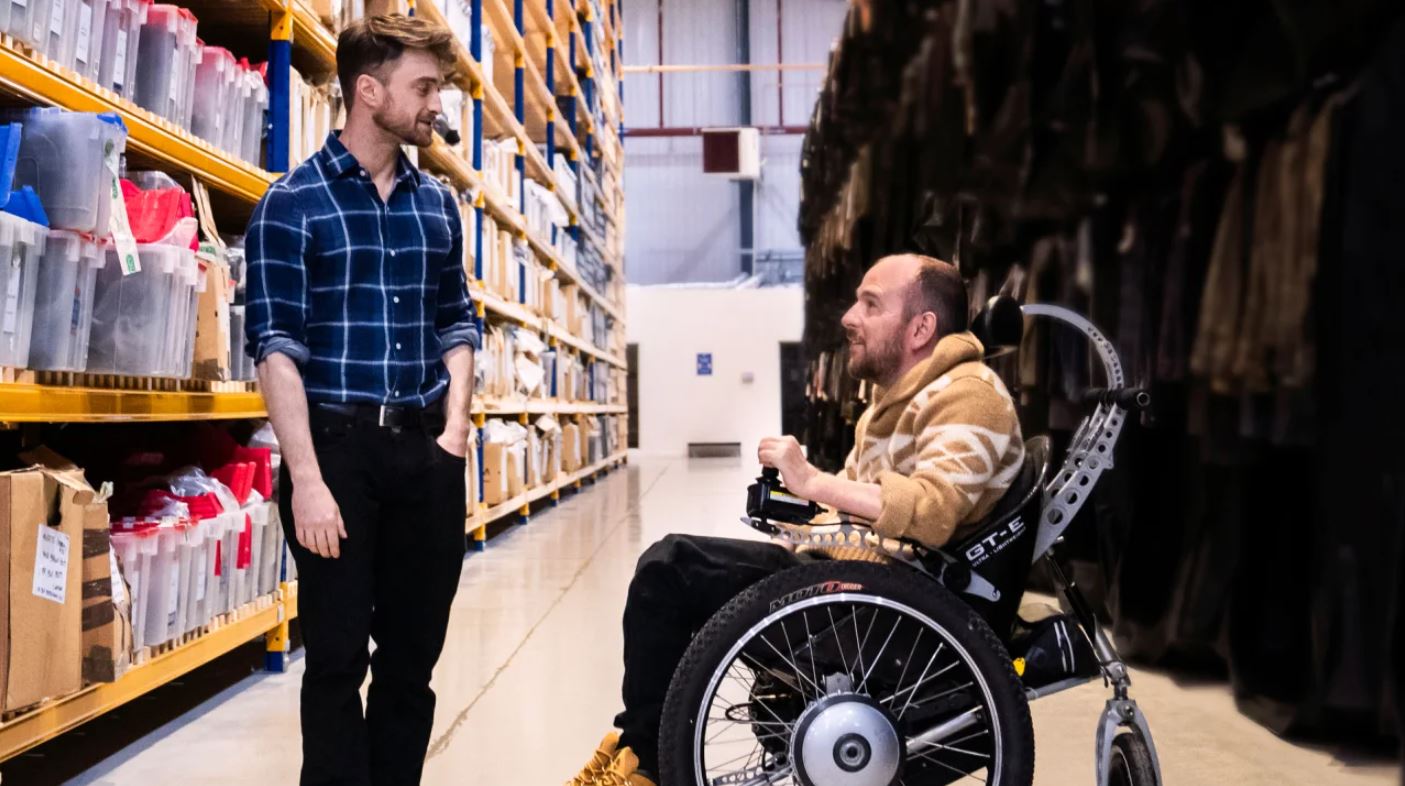 Radcliffe and Holmes share a moment in the upcoming documentary.